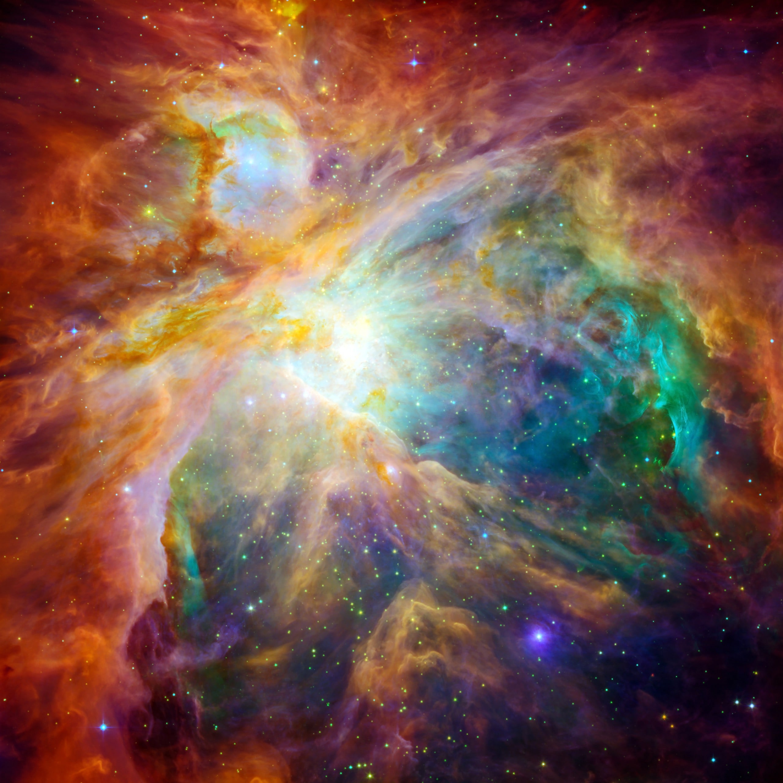 The cosmic cloud Orion Nebula - 1,500 light-years away from Earth. Retouched and cleaned version of original image with infrared and visible-light from Hubble Space Telescopes: NASA/JPL-Caltech/STScI