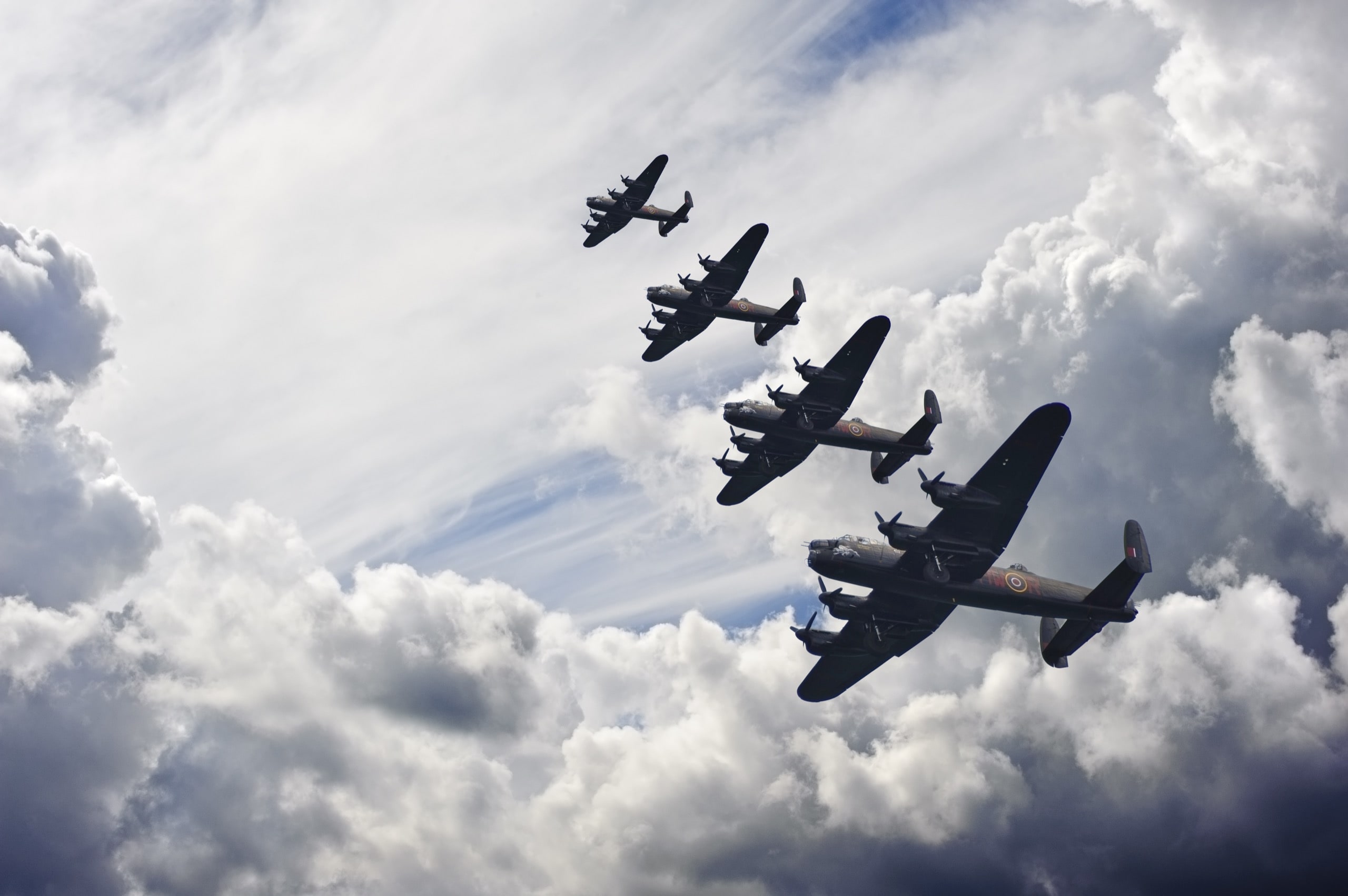 Flight formation of Battle of Britain World War Two consisting of Lancaster bombers banking right